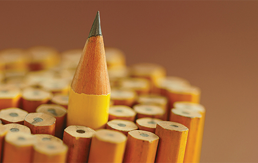 A raised pen in a stack of pens